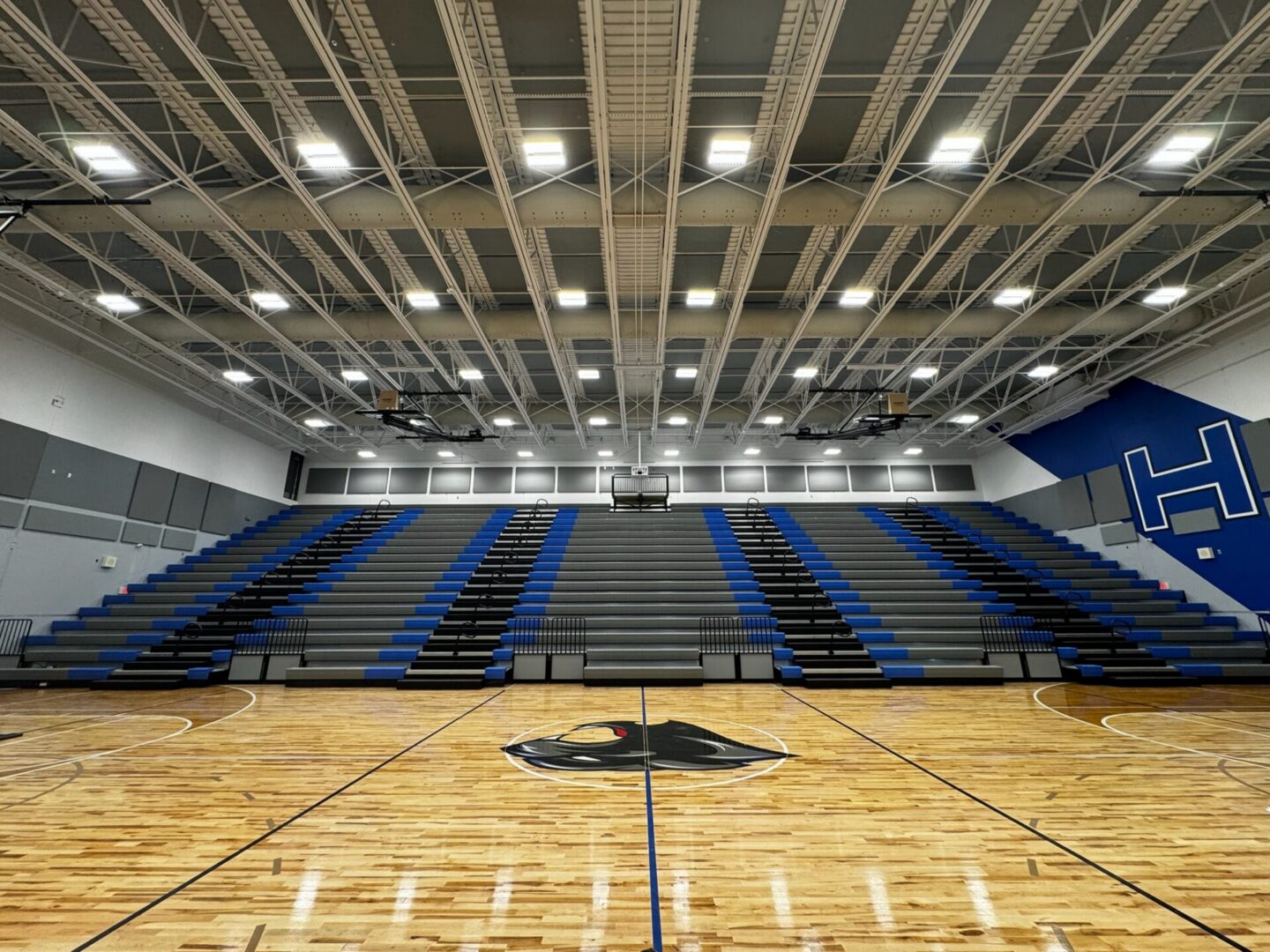 Basketball court with bleachers visible