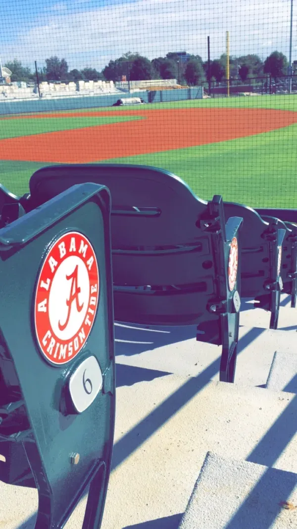 Baseball stadium seats, Alabama Crimson Tide logo.